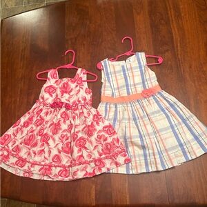 Two children’s dresses one made by Carter’s the other by Youngland 3T